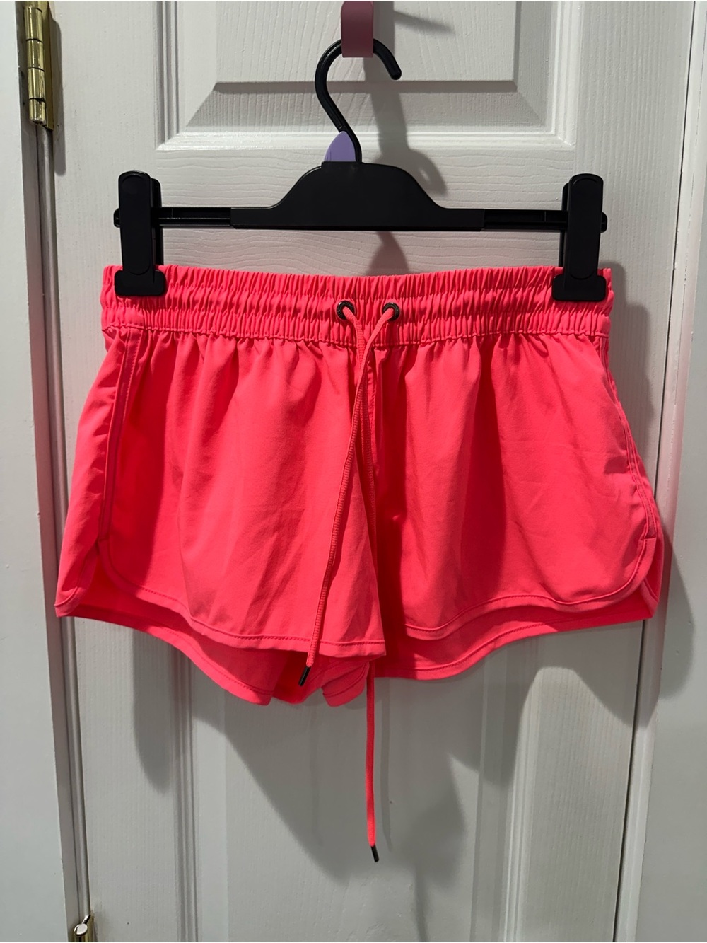 Neon orange swim shorts